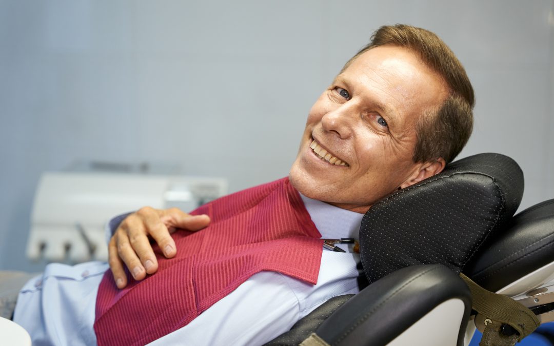 older man relaxed in a dental chair, sedation dentistry