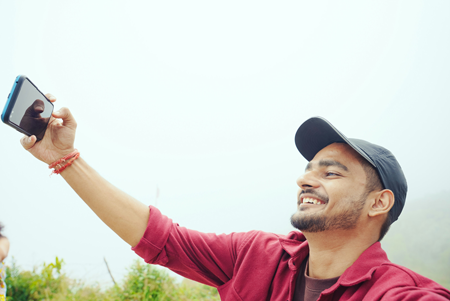 Young man takin a selfie in Kentucky has no fear of the dentist thanks to sedation dental care options at Palmer Family Dental