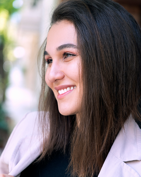 Smiling female cosmetic dentistry patient shows off nice teeth in Florence, KY